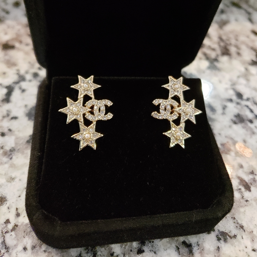 Vintage Coco Chanel tri star gold earrings
